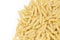 Pennette rigate. Raw pasta on white background. Space for text