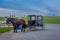 Pennsylvania, USA, APRIL, 18, 2018: Outdoor view of parked Amish buggy carriage in a farm with a horse used for a pull