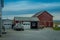 Pennsylvania, USA, APRIL, 18, 2018: Outdoor view of parked Amish buggy carriage in a garage close to a modern car