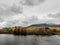 Penobscot River Calmly Flows Below a Cloudy Mount Katahdin