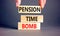 Pension time bomb symbol. Concept words Pension time bomb on wooden blocks on a beautiful grey table grey background. Businessman