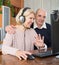 Pensioner sitting together at the computer