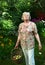 Pensioner woman pluck apples with basket close up photo