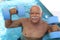 Pensioner working out in swimming pool