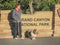 Pensioners with a dog on an evening walk in the Grand Canyon National Park. USA. Spring 2015