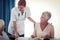 Pensioners at lunch with nurse