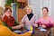 Pensioners playing board game