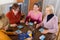 Pensioners playing board game