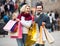 Pensioners with shopping bags on city street