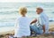 Pensioners sitting back together at the sea