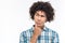 Pensive afro american man with curly hair looking away