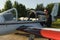 Pensive attrative young man pilot standing near small aircraft