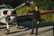 Pensive attrative young man pilot standing near small aircraft