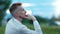 Pensive bearded European guy thinking and relaxing at evening outdoor medium close-up