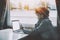 Pensive black girl with smartphone and laptop on ship