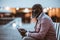 Pensive Black Man in Pink Jacket