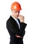 Pensive businessman in orange helmet