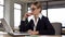 Pensive businesswoman sitting in office, thinking over career, startup ideas