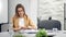 Pensive businesswoman thinking about work sitting at desk in office