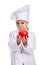 Pensive chef girl in a cap cook uniform, holding the red apple with both hands. Human emotions, facial expression