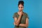 Pensive confused young african american woman girl in casual t-shirt posing isolated on blue background in studio