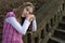 Pensive Cute Girl Leaning on Guitar and Looking at the Camera