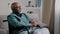 Pensive dreaming calm alone elderly patient. old African bald man with gray beard senior mature grandpa sit on