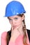 Pensive female construction worker.