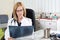 Pensive Female Doctor Looking at Patient\'s Lung X-ray in Consulting Room