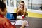 Pensive female student and thoughtful woman with smartphone