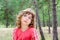 Pensive girl in forest thinking gesture