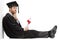 Pensive graduate male student holding a diploma sitting on the floor and leaning on a wall