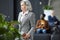 Pensive gray-haired lady in waiting area