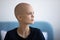 Pensive hairless female dream of happy future after defeating cancer