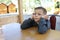 Pensive kid waiting food