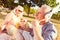 Pensive man enjoying music during family picnic