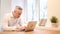 Pensive Middle Age Man Working on Laptop in Office