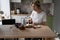 Pensive middle-aged single woman enjoying healthy breakfast alone in peace and quiet