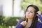 Pensive Mixed Race Female Student with Pencil on Campus