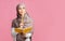 Pensive muslim girl holding notepad and pencil, thinking about something