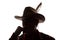 Pensive old man in cowboy hat, beard, front view - silhouette