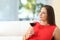 Pensive relaxed woman with a cup of wine