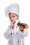 Pensive serious chef girl in a cap cook uniform, appraising the eclair. Looking at it. Portrait image