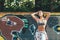 Pensive sporty woman posing at bright graffiti wall, relaxing from jog training