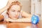 Pensive teenage girl with clock