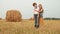 Pensive teenagers standing together on autumn field