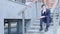 Pensive Thinking Young Businessman Sitting on Stairs Outside Office