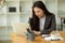 Pensive, Thoughtful, Serious, Ponder young asian businesswoman working on her laptop