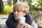 Pensive woman with coffee in a cafe on the street portrait lifestylepensive