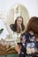 Pensive woman sitting at dressing table